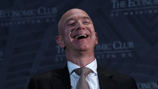 Jeff Bezos laughes all the way to the bank as he remains the world's richest person