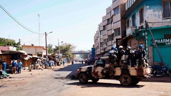 Malian riot police arrive in a vehicle as they deploy during a protest called by opposition parties in Bamako