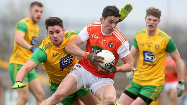 Armagh's Rory Grugan pursued by Brendan McCole and Conor Morrison