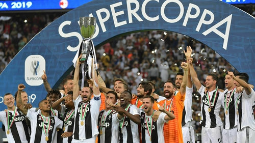 Juventus' Italian defender Giorgio Chiellini lifts the trophy
