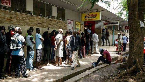 Long queues have formed at petrol stations and shops