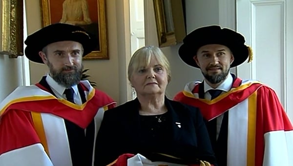 The Cranberries' Noel (L) and Mike (R) Hogan with Dolores O'Riordan's mother Eileen O'Riordan at the University of Limerick on Friday