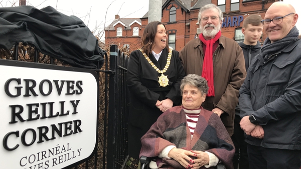 Belfast Lord Mayor Deirdre Hargey, Gerry Adams and MP Paul Maskey with Clara Reilly (front) at the corner of the Falls Road in west Belfast