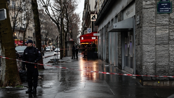 French police cordon off the area around the Milleis Bank close to the Champs-Elysees Avenue