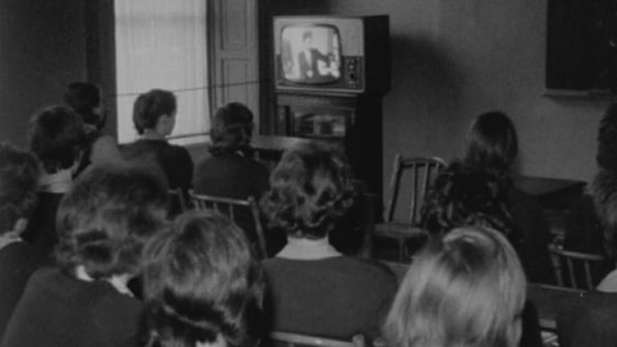 Secondary school students watching 'Telefis Scoile' in classroom (1964)