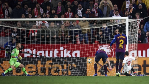 Wissam Ben Yedder slips home Sevilla's second goal against Barcelona