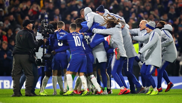 Chelsea players react after the shootout victory over Spurs