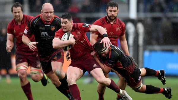 Munster's Ronan O'Mahony tries to hold off Nic Cudd of Dragons