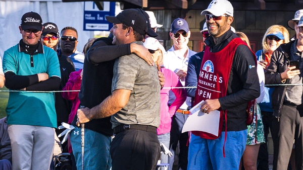Jordan Spieth and Patrick Reed embrace at the first tee