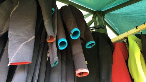 The core material of wetsuits is neoprene foam, a synthetic rubber made from petroleum.