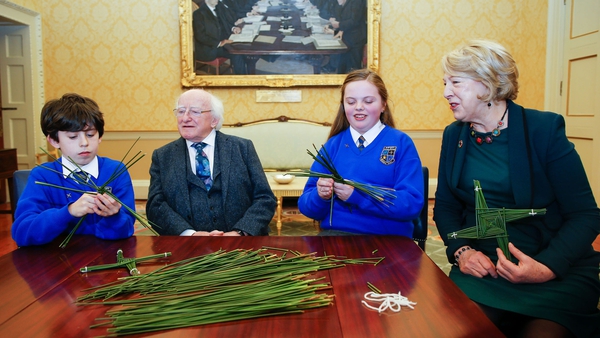 Oisín Lee and Sophie Hannon from St Brigid's Primary School, Kildare make St Brigid's crosses for President Michael D Higgins and Sabina Higgins at Áras An Uachtaráin. Photo: Kenneth O'Halloran (file photo)
