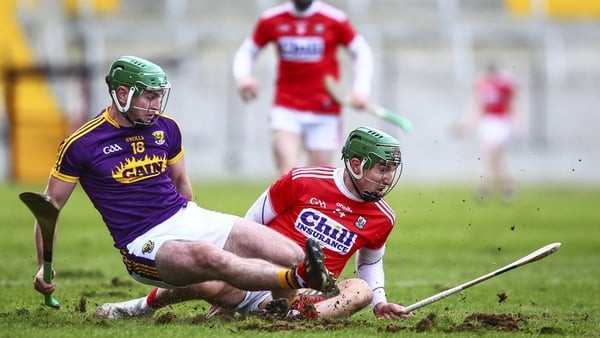 Darren Byrne and Cork's Aidan Walsh battle for possession