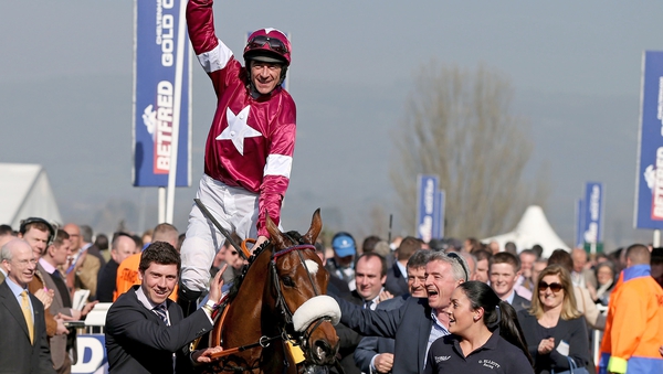 Davy Russell celebrates winning the 2018 Grand National on Tiger Roll