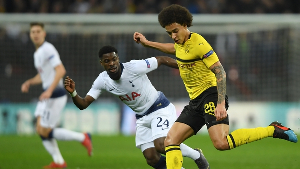 Axel Witsel of Borussia Dortmund is challenged by Serge Aurier