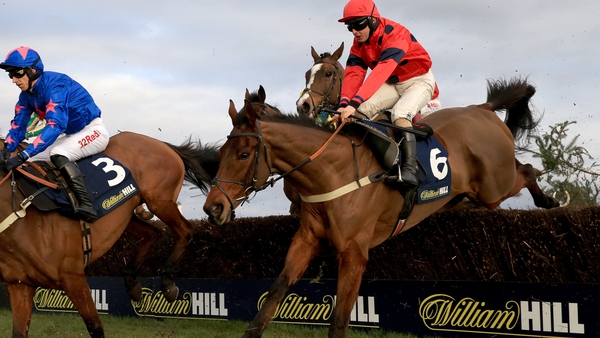Robinsfirth and Sean Bowen (right) clear a hurdle on their way to victory