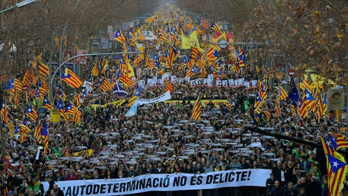 Demonstrators waved blue, red and yellow Catalan separatist flags and carried banners reading 'Freedom for political prisoners'