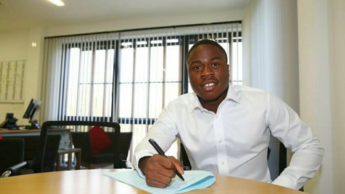 Michael Obafemi signing his new contract