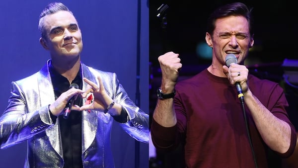 Hugh Jackman is inviting Robbie Williams to be his guest because 