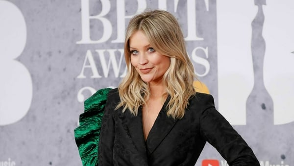 Laura Whitmore poses on the red carpet on arrival for the BRIT Awards 2019.