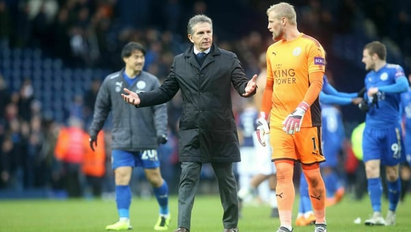 Puel (second from L) and Kasper Schmeichel having a chat