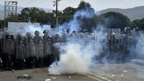 Venezuelan national policemen clash with demonstrators at the Simon Bolivar bridge