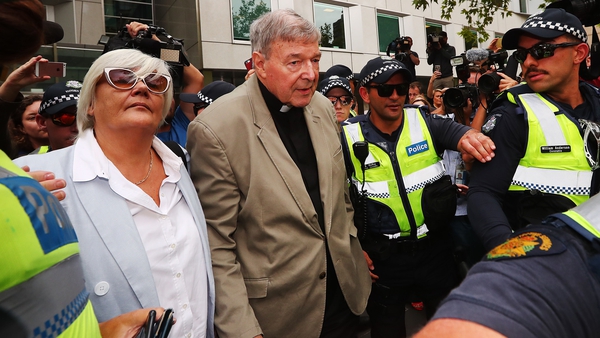 George Pell leaves the County Court of Victoria after reporting restrictions were lifted