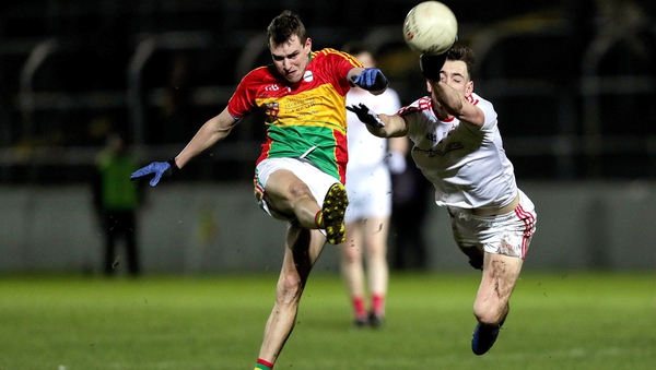 Fergal Donohoe of Louth attempts to block Carlow's Sean Gannon and