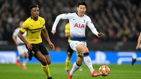 Dan-Axel Zagadou of Borussia Dortmund in action against Heung-Min Son of Tottenham Hotspur
