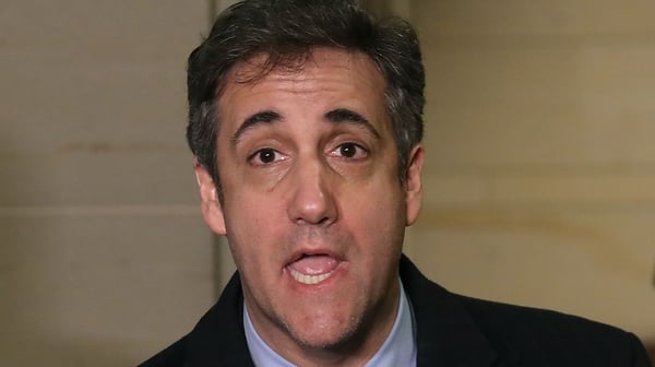 Michael Cohen speaks to the media after appearing before a closed door House Intelligence Committee hearing