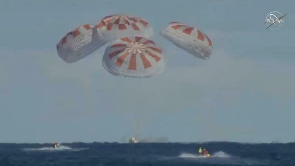Live footage from NASA showed the capsule splashing down into the ocean
