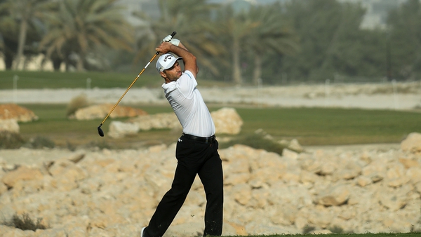 Oliver Wilson plays into the 18th green during the third round of the Qatar Masters