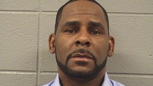 R Kelly pictured after being arrested for unpaid child support on March 6