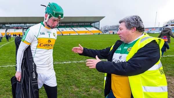 Offaly goalkeeper Eoghan Cahill is consoled by Offaly fan Mick McDonagh after the defeat to Carlow