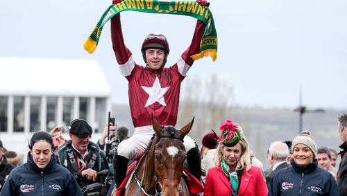 Keith Donoghue holds up a a Meath scarf as he celebrates on Tiger Roll