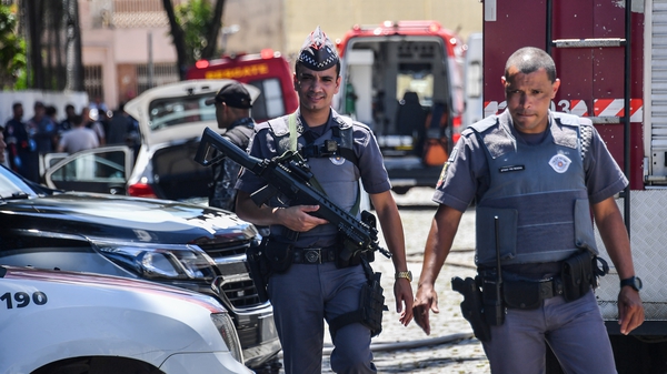 Police said the gunmen took their own lives after the shooting at the Raul Brasil public school
