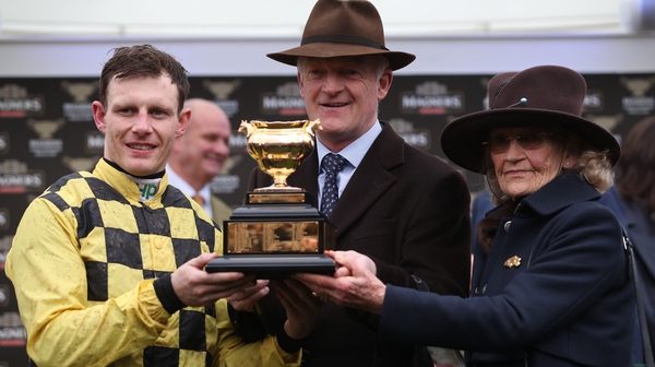 Paul Townend (L), Willie Mullins (C) and Mullins' mother Maureen with the Gold Cup