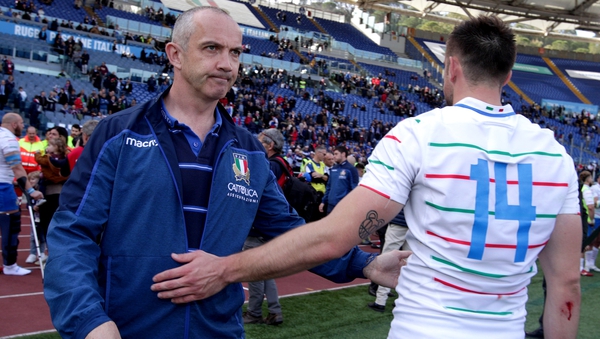 Italy head coach Conor O'Shea consoles Edoardo Padovani after the game