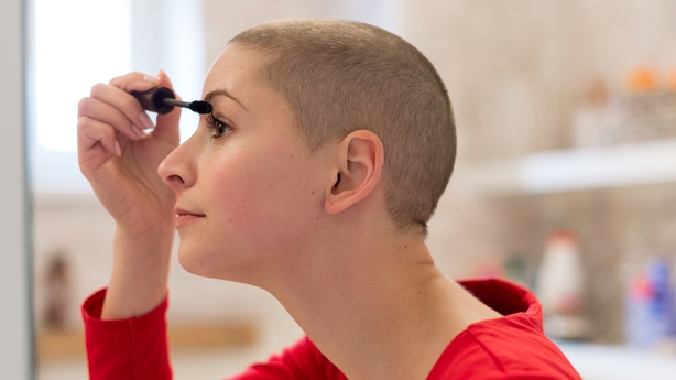 woman applying makeup