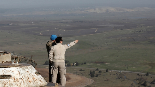 UN personnel survey the Israel-Syria border