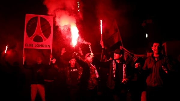 PSG fans light flares and smoke bombs outside the stadium after the UEFA Women's Champions League quarter-final first leg defeat to Chelsea