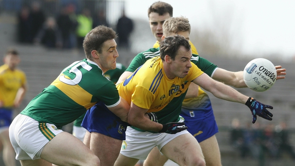 Roscommon's Niall Kilroy tackled by Stephen O'Brien and Peter Crowley
