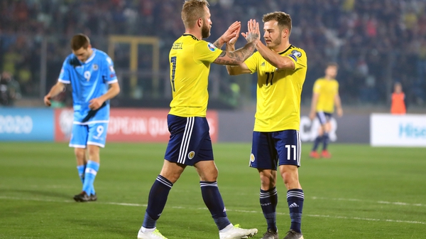 Scotland's Johnny Russell celebrates scoring his side's second goal with Ryan Fraser