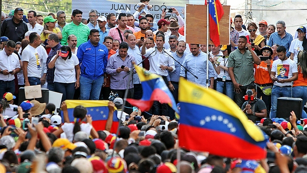National Assembly President Juan Guaido speaks to protesters