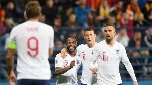 Harry Kane celebrates Raheem Sterling's goal on Monday night