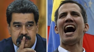 Venezuelan opposition leader Juan Guaido (R) and President Nicolas Maduro have rival claims to be the legitimate leader