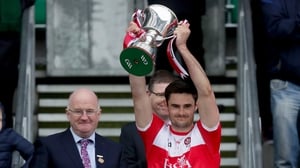 The Derry captain hoists the Division 4 trophy