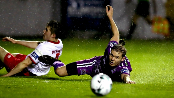 Georgie Kelly of Dundalk has eyes on the ball after tangling with Lee Desmond of St Pat's