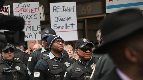 About 300 people, including off-duty Chicago police officers, gathered in downtown Chicago