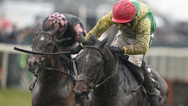 Robbie Power riding Supasundae (red cap) clears the last to win The Betway Aintree Hurdle
