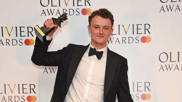 Chris Walley celebrates with his award